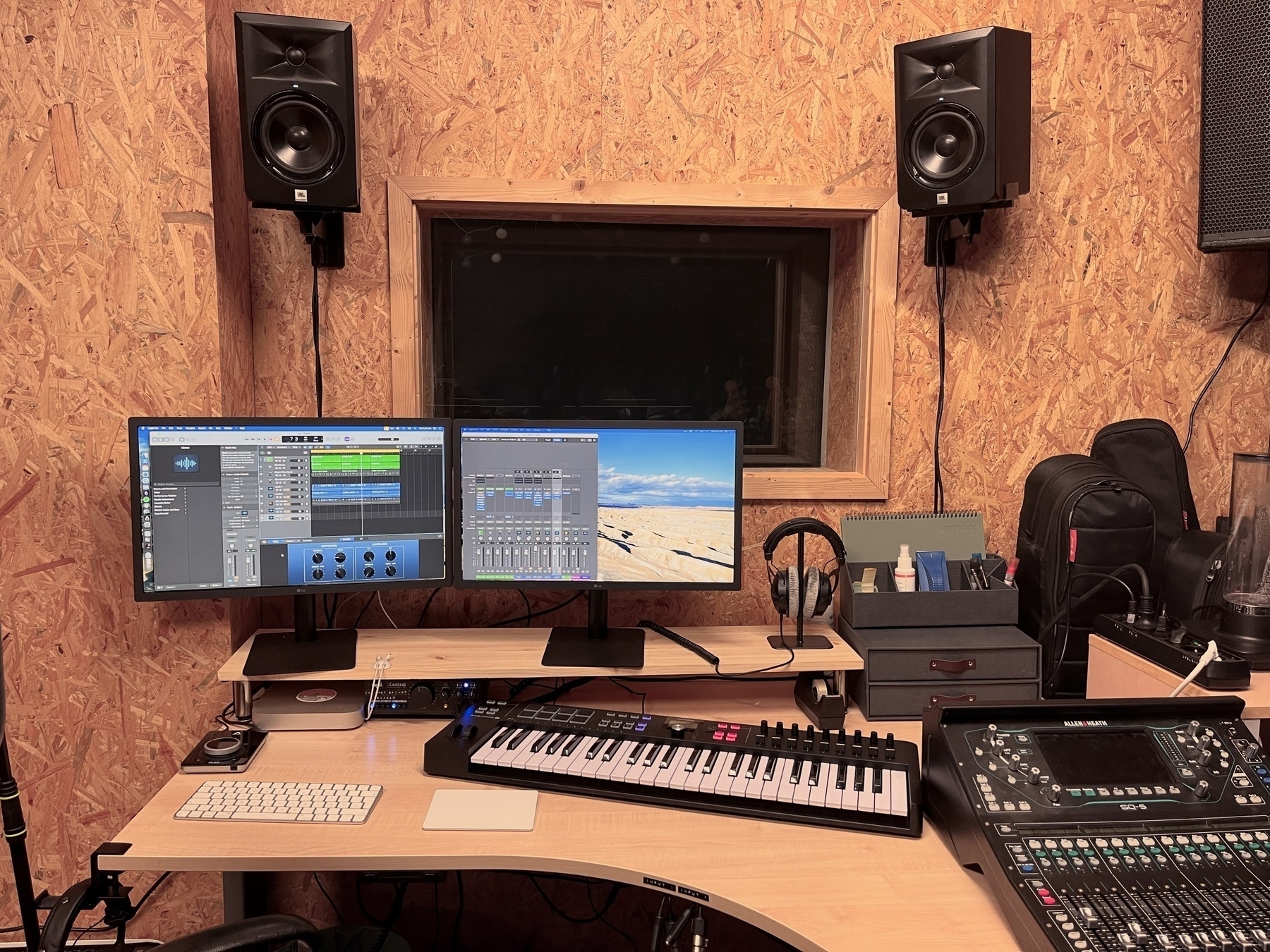 Our studio setup, with a Mac Mini, Apogee Duet 3, two LG UltraFine 24-inch screens, MIDI keyboard, studio monitors and more.